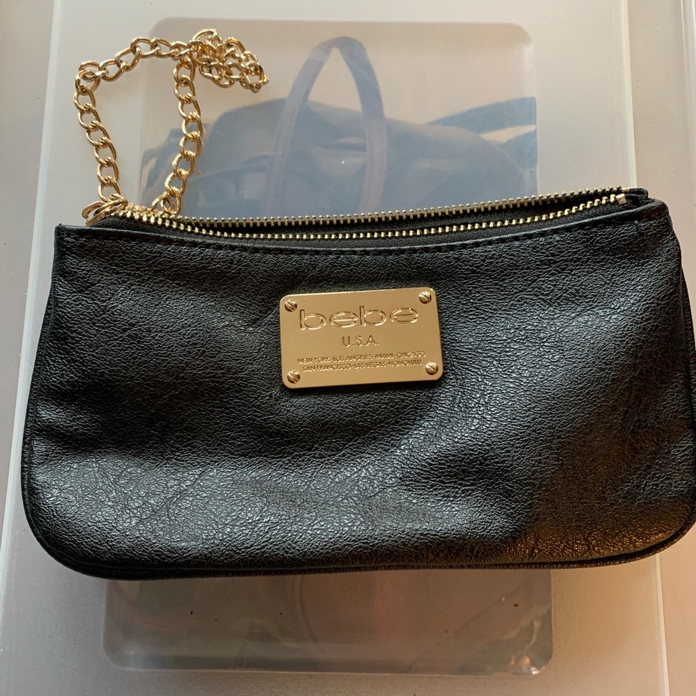 Bebe vegan black and gold clutch